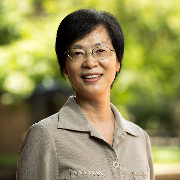 Judy Jin smiles and poses for a portrait.