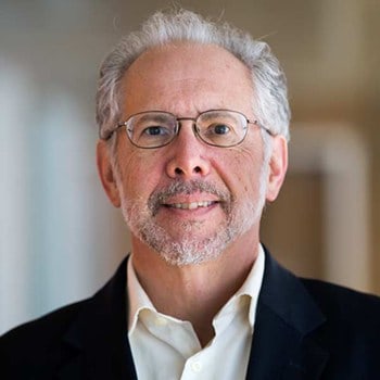 Jeffrey Liker smiles and poses for a portrait.