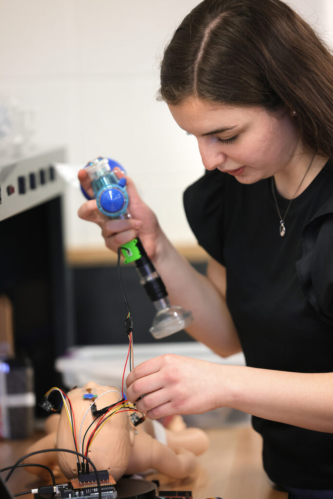 Jacquline Hannah performs an experiment on a dummy