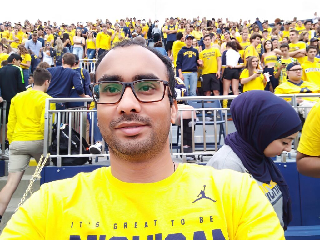 Chandra attending a football game at the University of Michigan