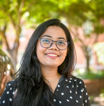 Naurin Zoha smiles and poses for a portrait.