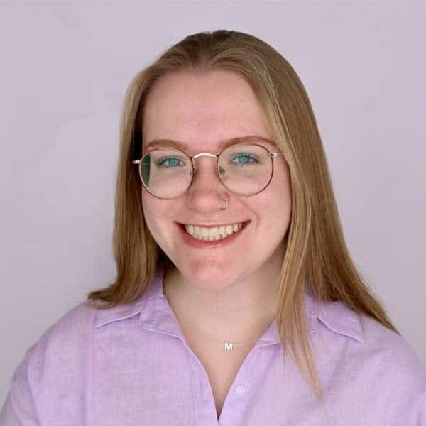 Maddy Denny smiles and poses for a portrait.