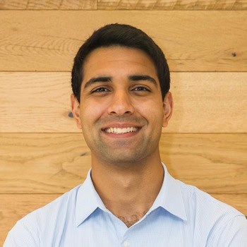 Nick Sandhu smiles and poses for a portrait