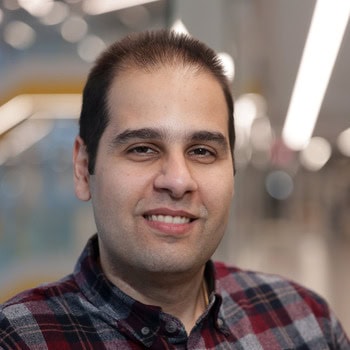 Amirhossein Moosavi smiles and poses for a portrait