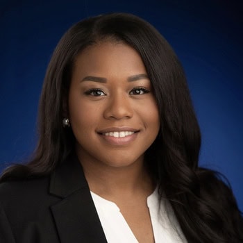 Gina Mason Woods smiles and poses for a portrait